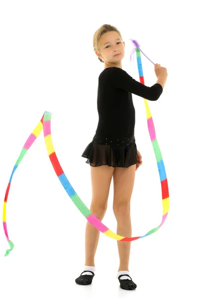 Girl gymnast performs exercises with tape. — Stock Photo, Image