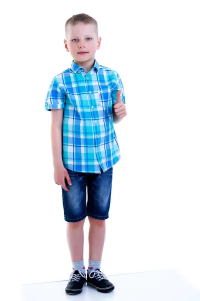 A little boy is holding a finger up.The concept of emotion and t — Stock Photo, Image