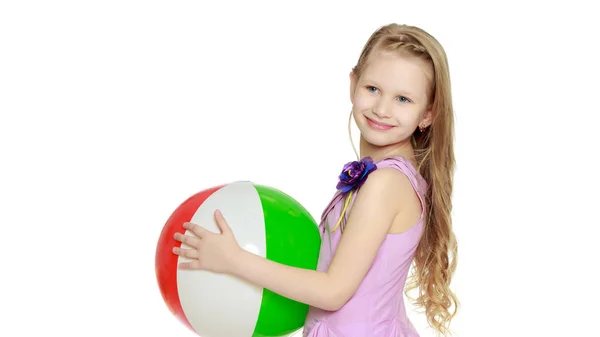 Little girl is playing with a ball.The concept of childrens spo — Stock Photo, Image