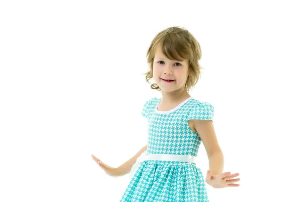 A cheerful little girl is dancing. — Stock Photo, Image