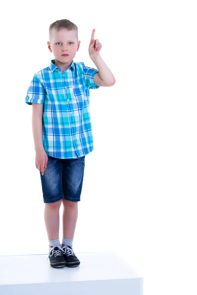 The boy points a finger at something. — Stock Photo, Image