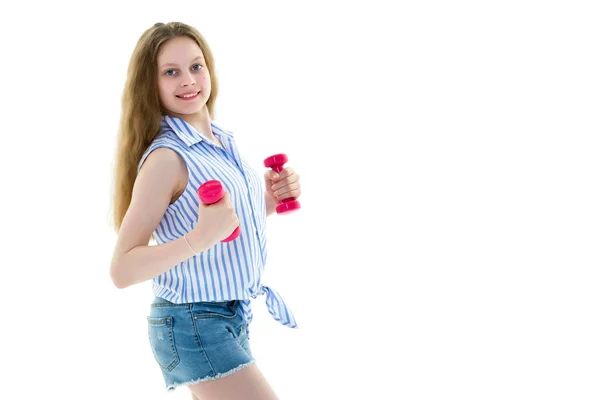 Tiener meisje met halters in de handen — Stockfoto