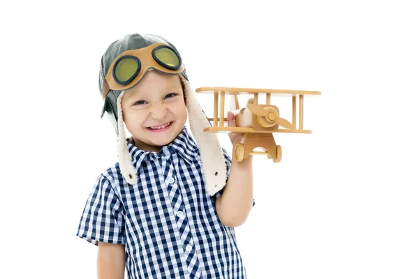 Little boy playing with wooden plane — Stock Photo, Image