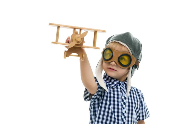 Little boy playing with wooden plane — Stock Photo, Image