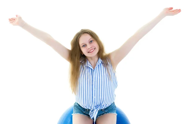 Little girl doing exercises on a big ball for fitness. — Stock Photo, Image