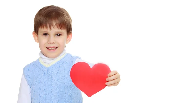 The little boy holds in his hand and heart. — Stock Photo, Image
