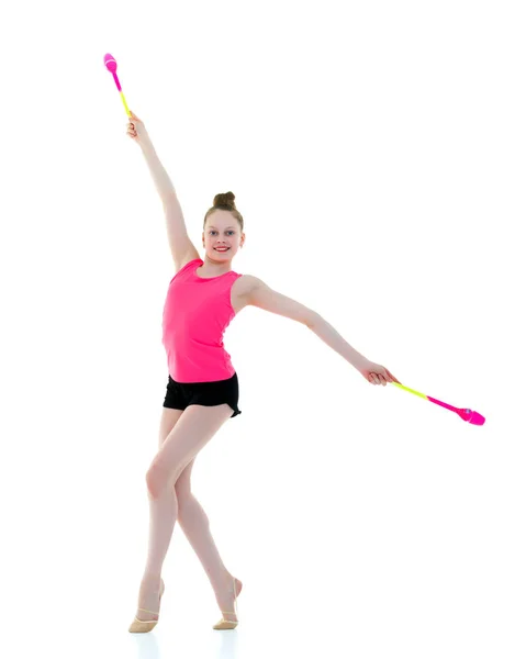 A girl gymnast performs exercises with a mace. — Stock Photo, Image