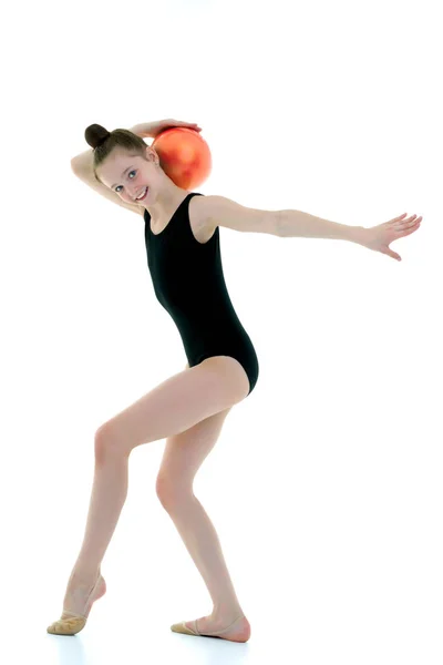 Little girl is engaged in fitness with a ball. — Stock Photo, Image