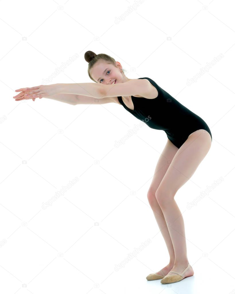 The gymnast prepares to perform the exercise.