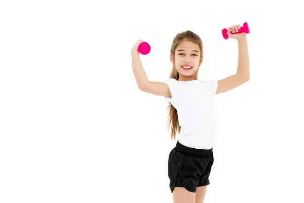 Menina fazendo exercícios com halteres. — Fotografia de Stock