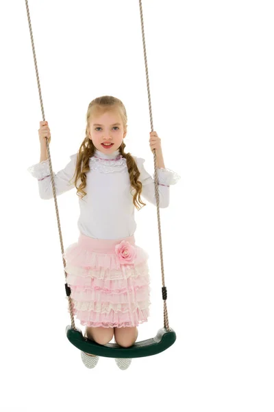Beautiful teen school girl swinging on a swing. Concept summer v — Stock Photo, Image