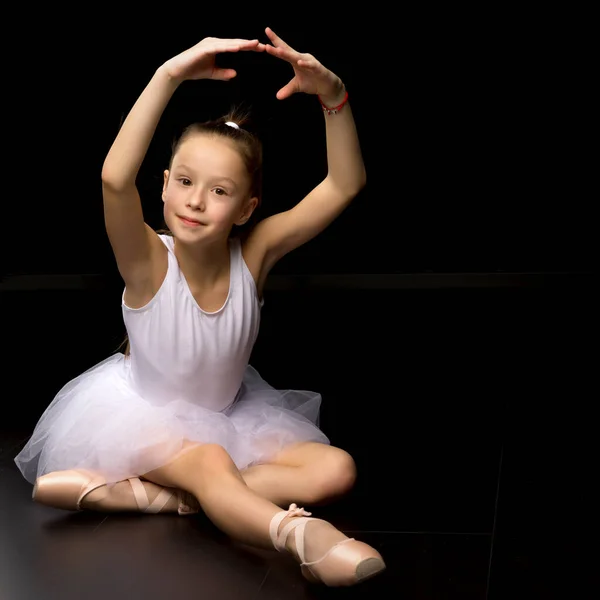 Beautiful little ballerina on a black background. dance concept. — Stock Photo, Image