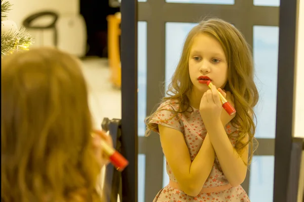 Charming Long Haired Girl Applying Lipstick in front of Mirror — Stock Photo, Image