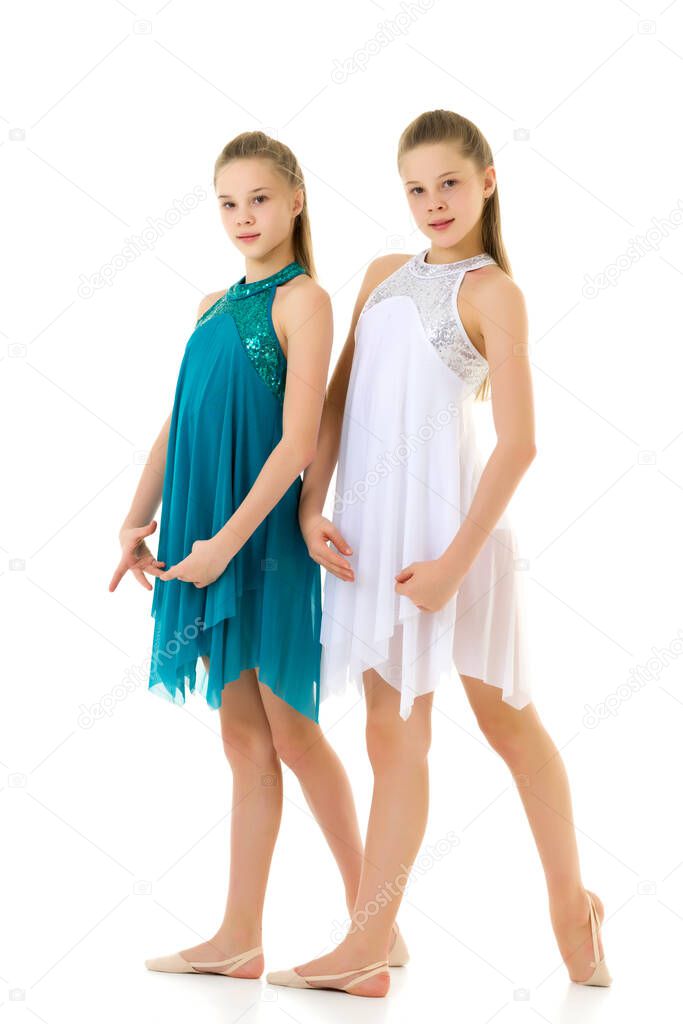Two Twin Sisters Dancing Wearing White and Blue Sport Dresses
