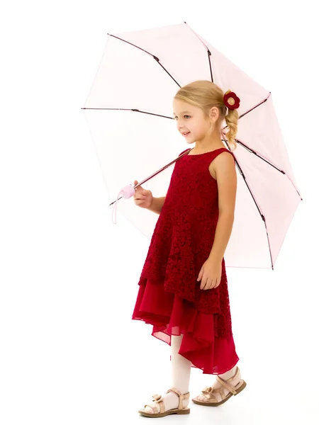 Little girl under an umbrella.Concept style and fashion. Isolated on white background. — Stock Photo, Image