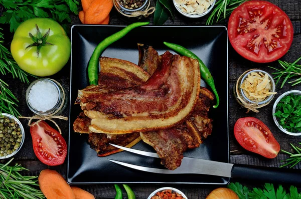 Pork meat with vegetables on table — Stock Photo, Image