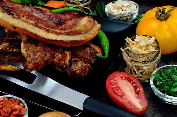 Pork meat with vegetables on table — Stock Photo, Image