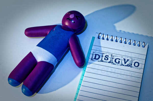 Doll DSGVO (General Data Protection Regulation) in English To Do GDPR (General Data Protection Regulation) with a notepad introducing the GDPR in the EU on 25.05.2018