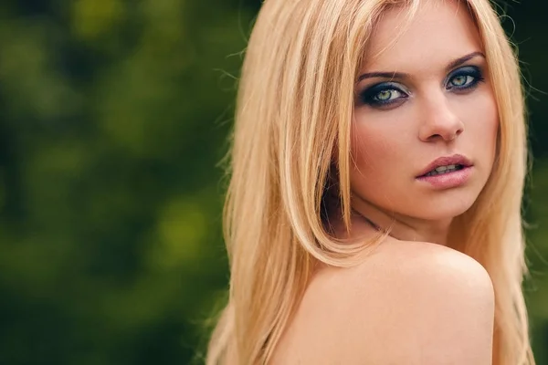 Outdoor blonde girl closeup portrait in a park — Stock Photo, Image