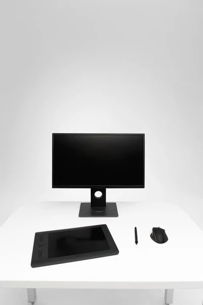 Computer display on desk. Desktop computer with photo retouching tools. Modern creative photographer or designer workspace background. Front view