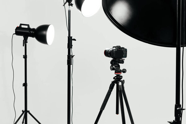 Camera with lighting equipment in studio 