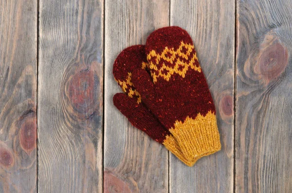 Handmade red mittens. View from above.