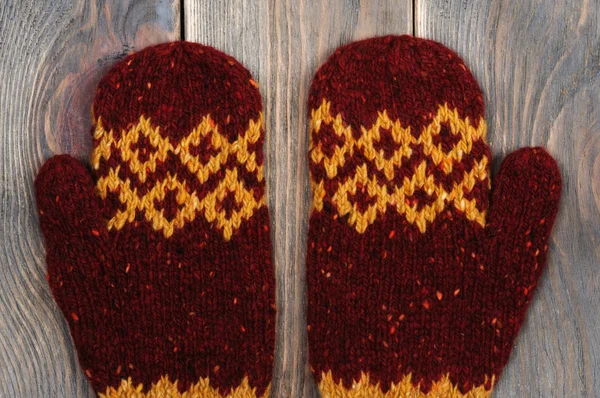 Handmade red mittens. View from above.