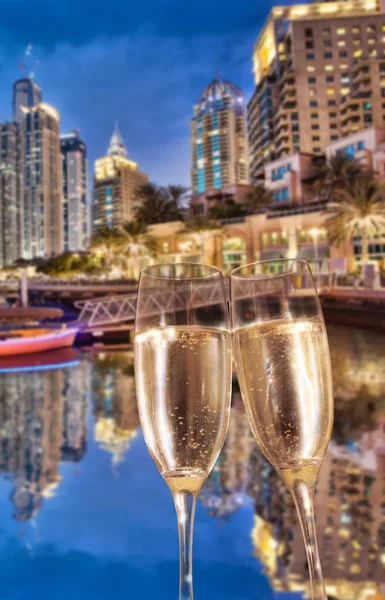 Toasting with champagne against Dubai marina in United Arab Emirates — Stock Photo, Image