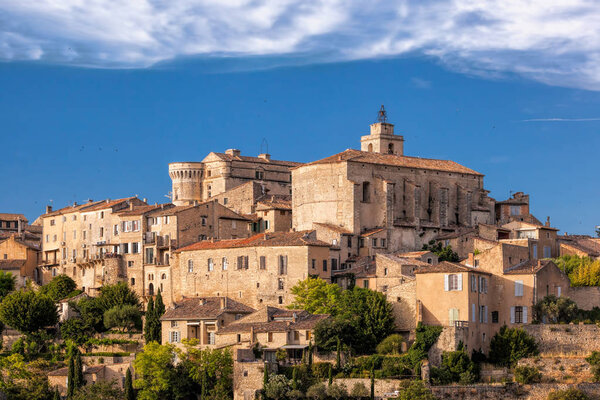 Famous old village Gordes in Provence against sunset in France