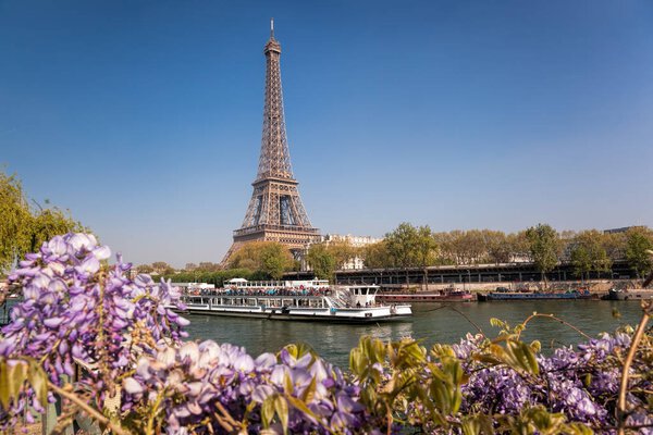 Eiffel Tower with boat during spring time in Paris, France