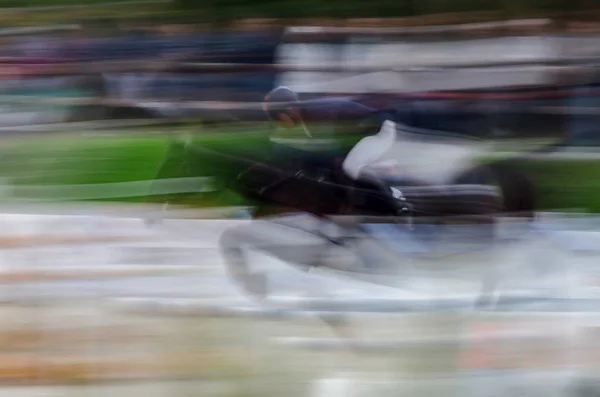 Abstraktes Bild mit Pferd beim Springreiten — Stockfoto