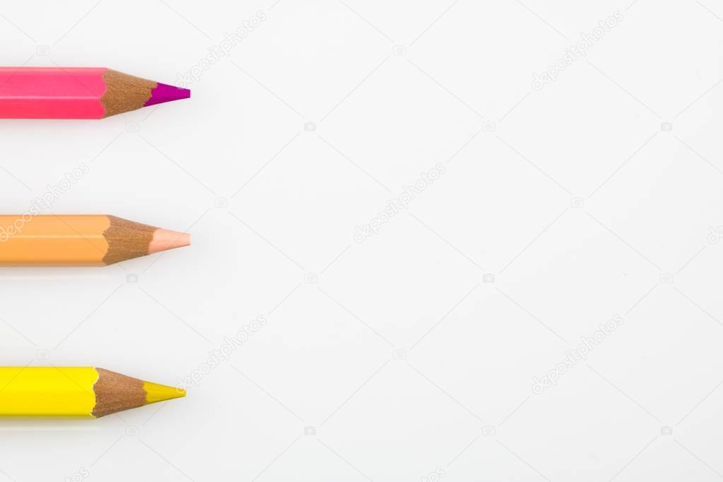 A row of colored pencils