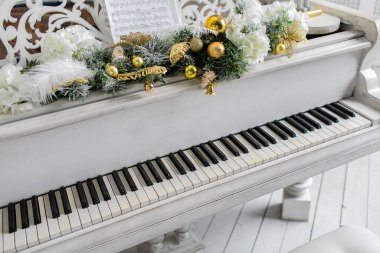 White piano in white room. play music. clipart