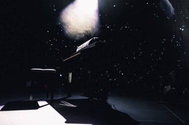 black piano on stage. grand piano on the stage before the performance clipart