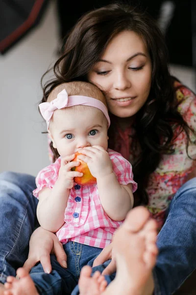 Loving young mother laughing embracing smiling cute funny kid daughter enjoying time together at home — Stock Photo, Image