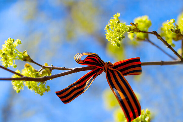 St. George's ribbon against the sky as a symbol of Russia Day, 12 