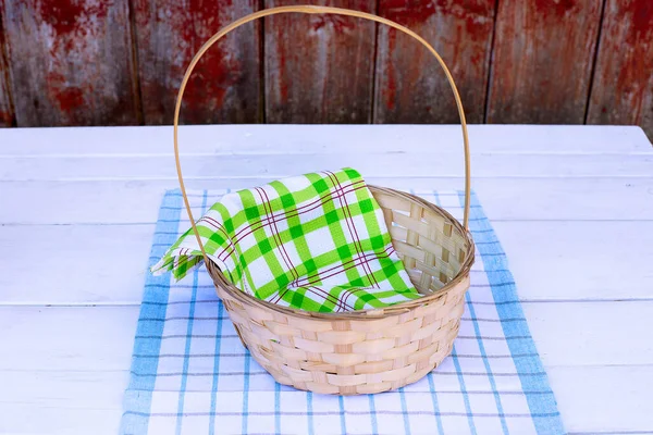 Empty basket on a wooden table, rustic style