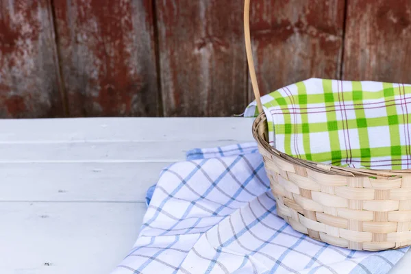 Empty basket on a wooden table, rustic style