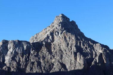 Razor mountain peak in the morning clipart