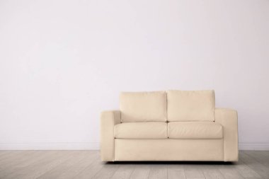 Elegant room interior with comfortable sofa clipart