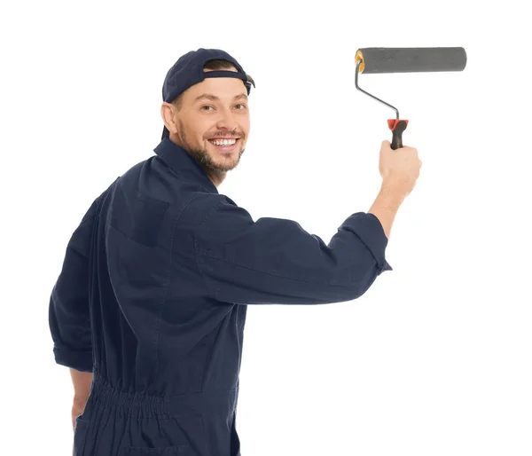 Young male decorator with paint roller on white background — Stock Photo, Image