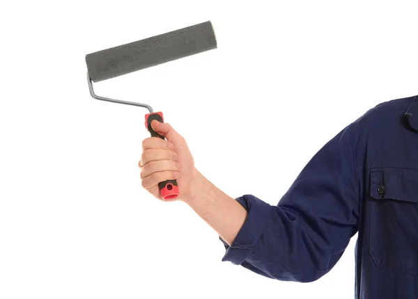 Young male decorator with paint roller on white background — Stock Photo, Image