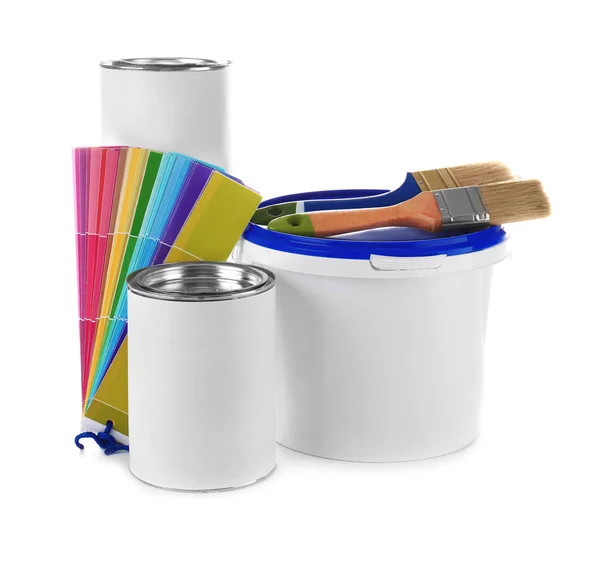 Paint cans, color palette samples and brushes for interior decorating on white background Stock Picture
