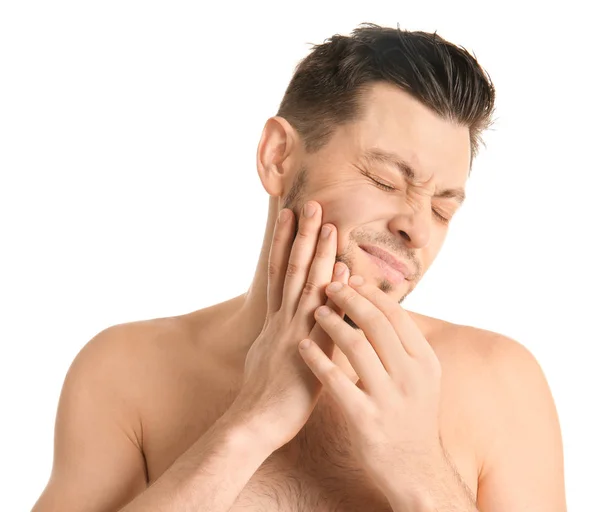 Young man suffering from toothache on white background — Stock Photo, Image