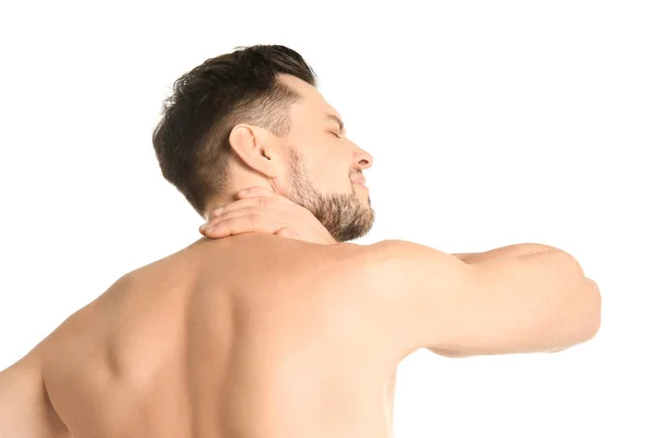 Jonge man die lijden aan nekpijn op witte achtergrond — Stockfoto