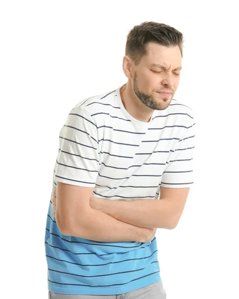 Młody człowiek cierpi na ból brzucha na białym tle — Zdjęcie stockowe