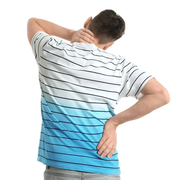 Young man suffering from neck pain on white background — Stock Photo, Image