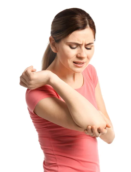 Young woman suffering from elbow pain on white background — Stock Photo, Image