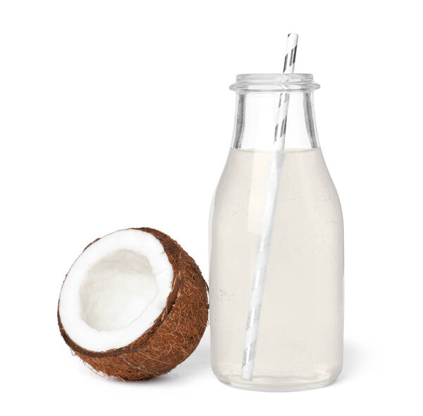 Bottle of coconut water and fresh nut on white background