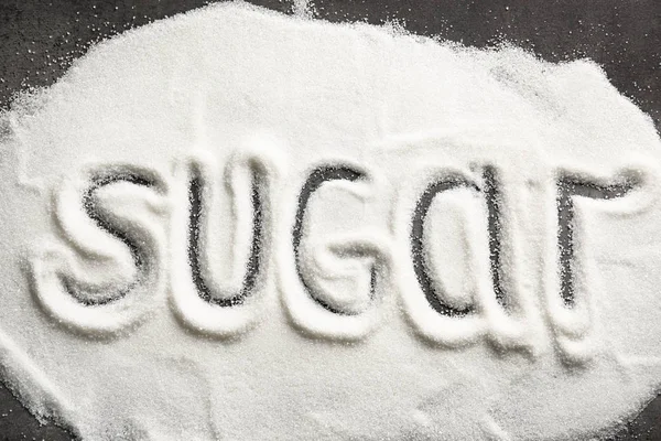 Gri arka plan üzerinde kelime şeker ile kompozisyon — Stok fotoğraf